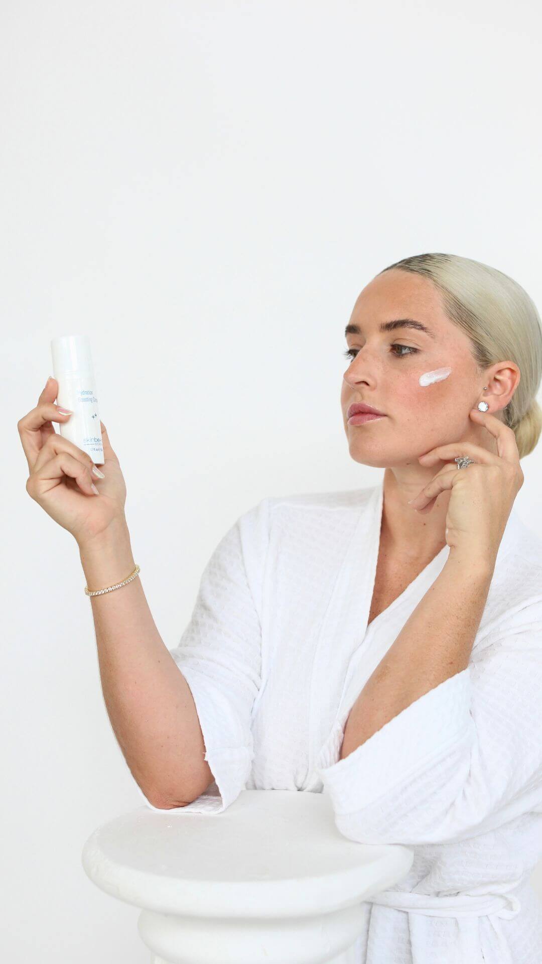 Woman with moisturizer on her face